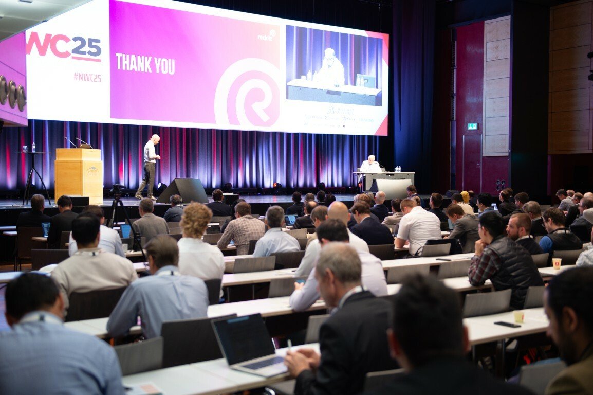 A presenter delivering a session at the NAFEMS Worlc Congress 2025 in Salzburg, Austria